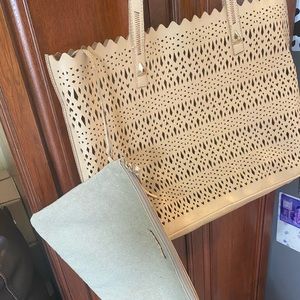 Large leather tote bag. Sand/ beige in color with burlap makeup bag attached.